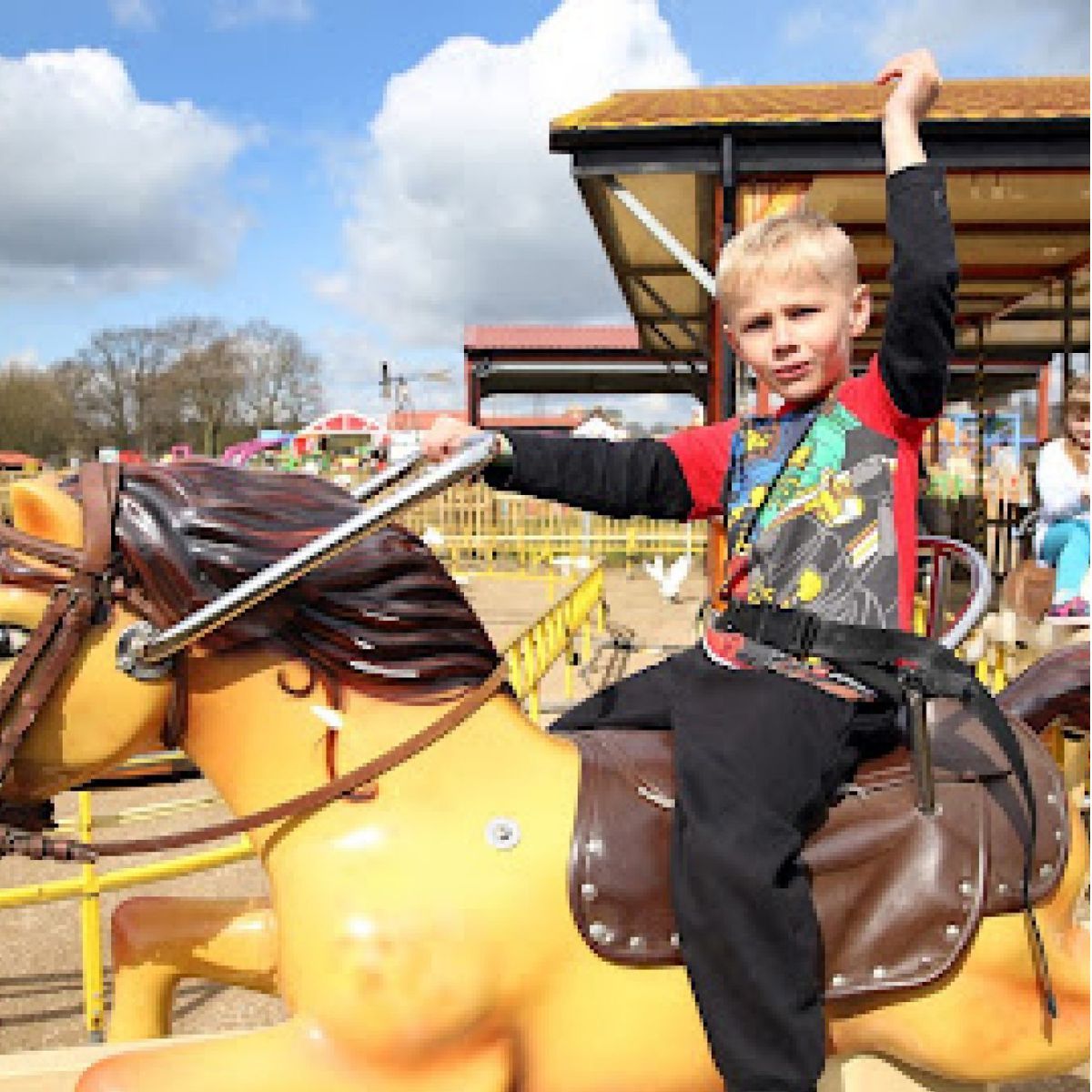 Picture of a boy on a fairground ride