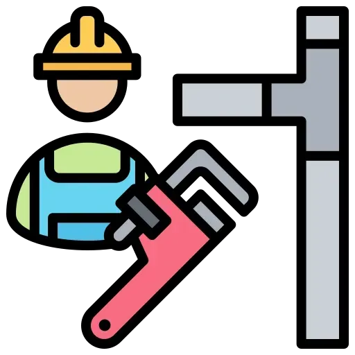 Plumber wearing a hard hat and overalls, holding a wrench near pipes.