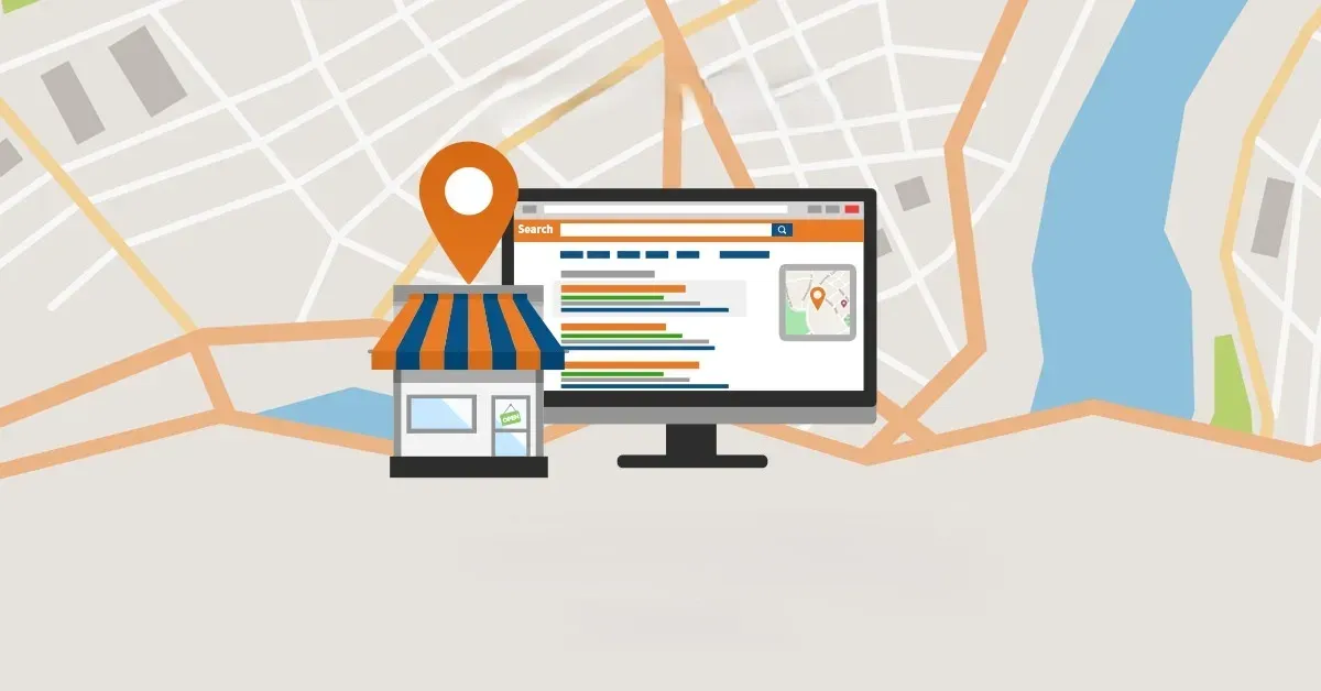 A computer monitor is sitting on top of a map next to a store.