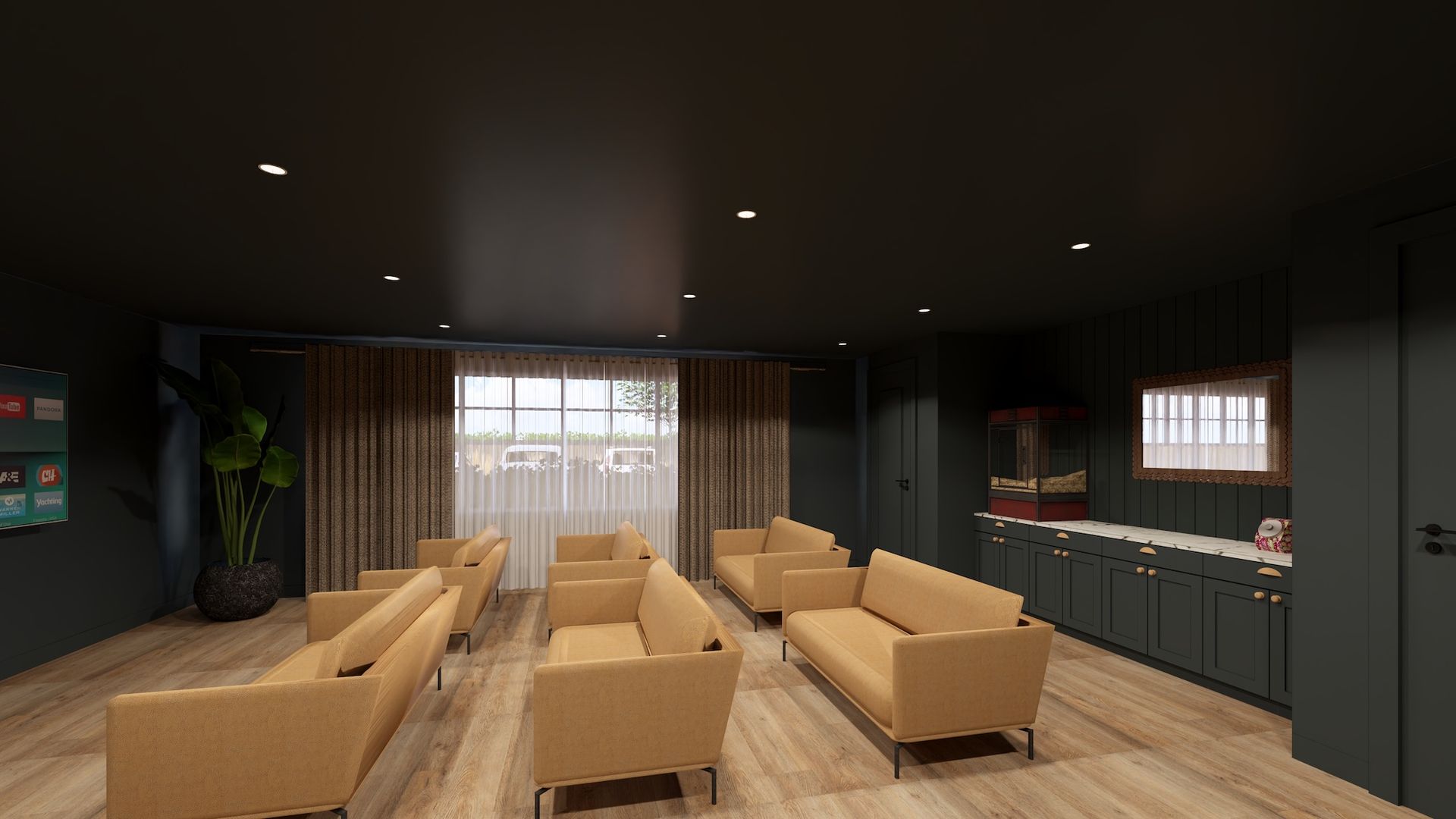 A modern waiting room with tan furniture, dark walls, and a kitchenette.