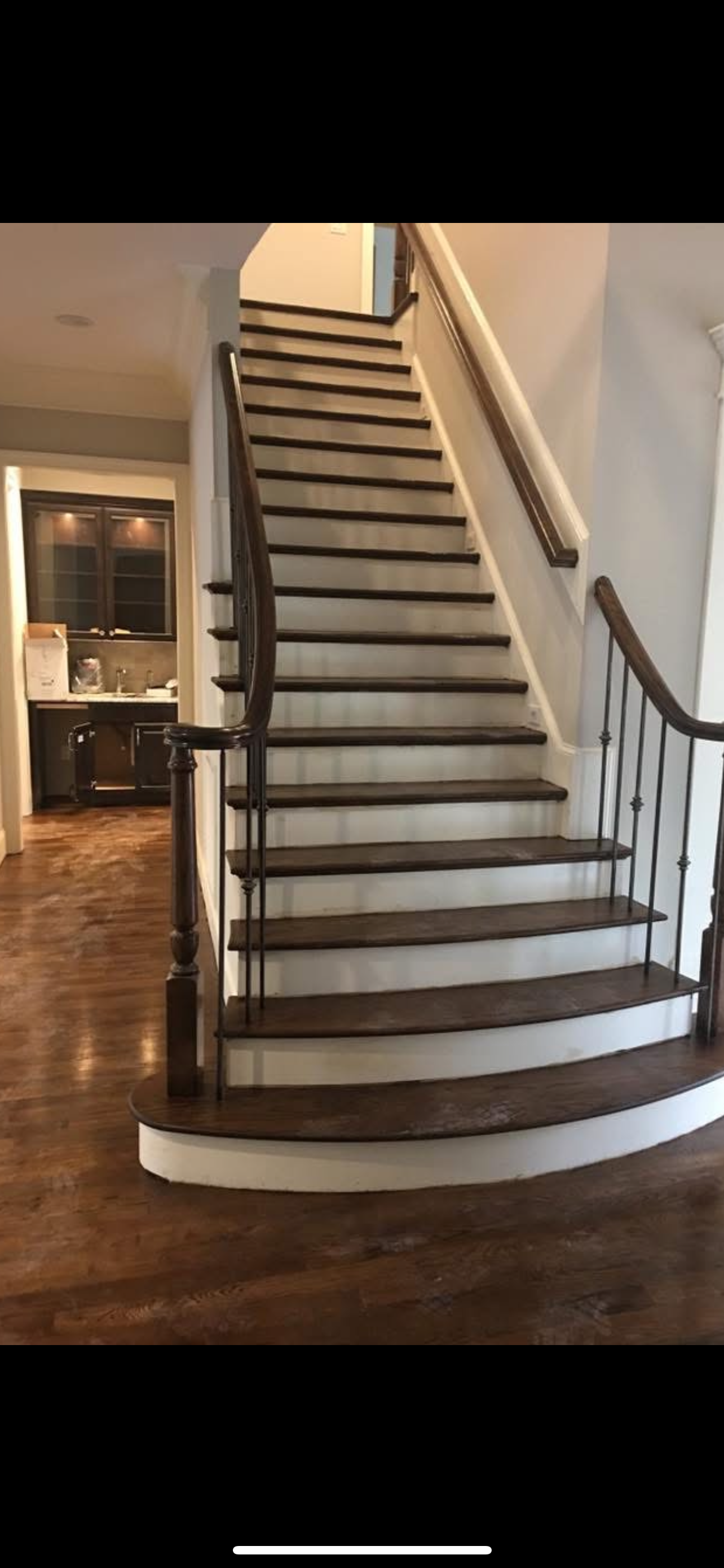 A living room filled with furniture and a television.