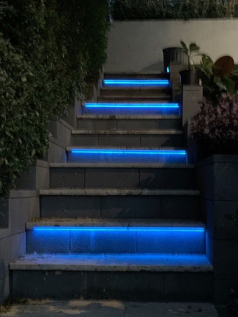 Outdoor staircase at night with blue LED strip lighting — Channel Electrical In Swansea Heads, NSW