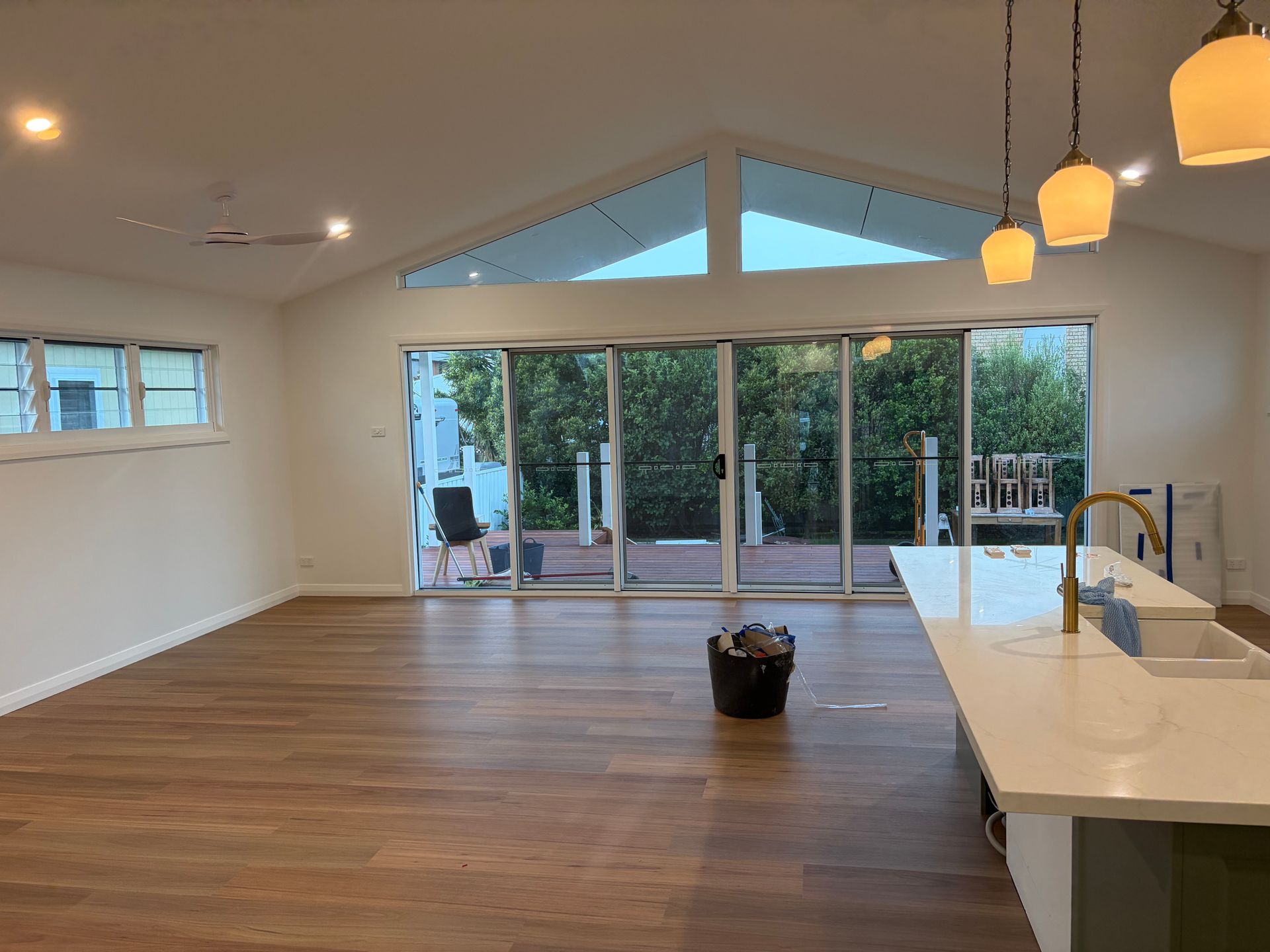 A bright, open-plan room with wood flooring — Channel Electrical In Swansea Heads, NSW