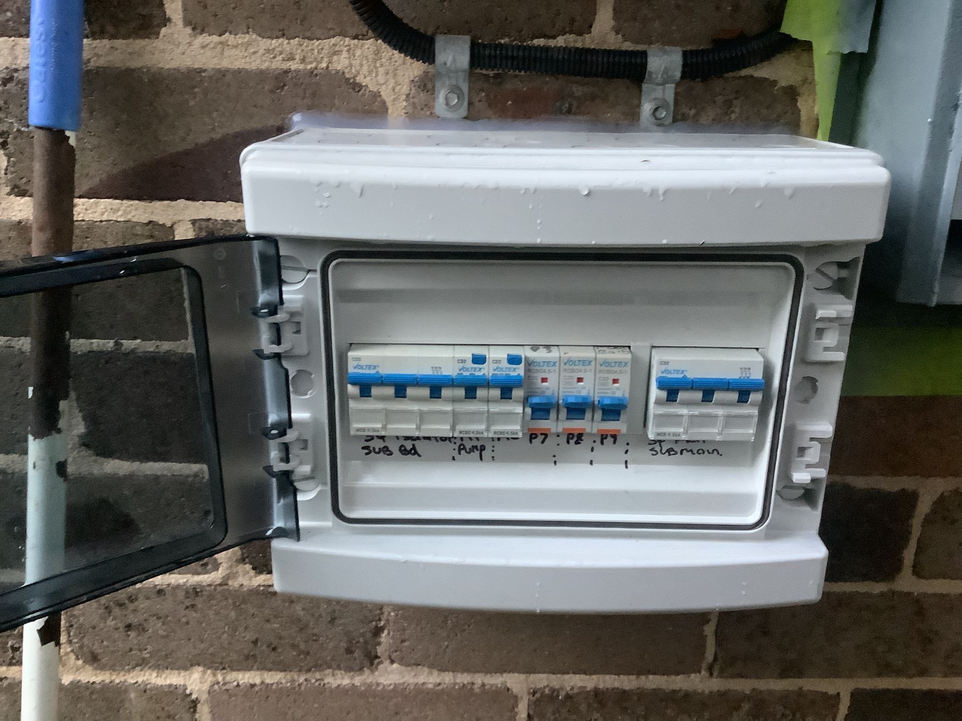 An open white plastic electrical distribution box — Channel Electrical In Swansea Heads, NSW