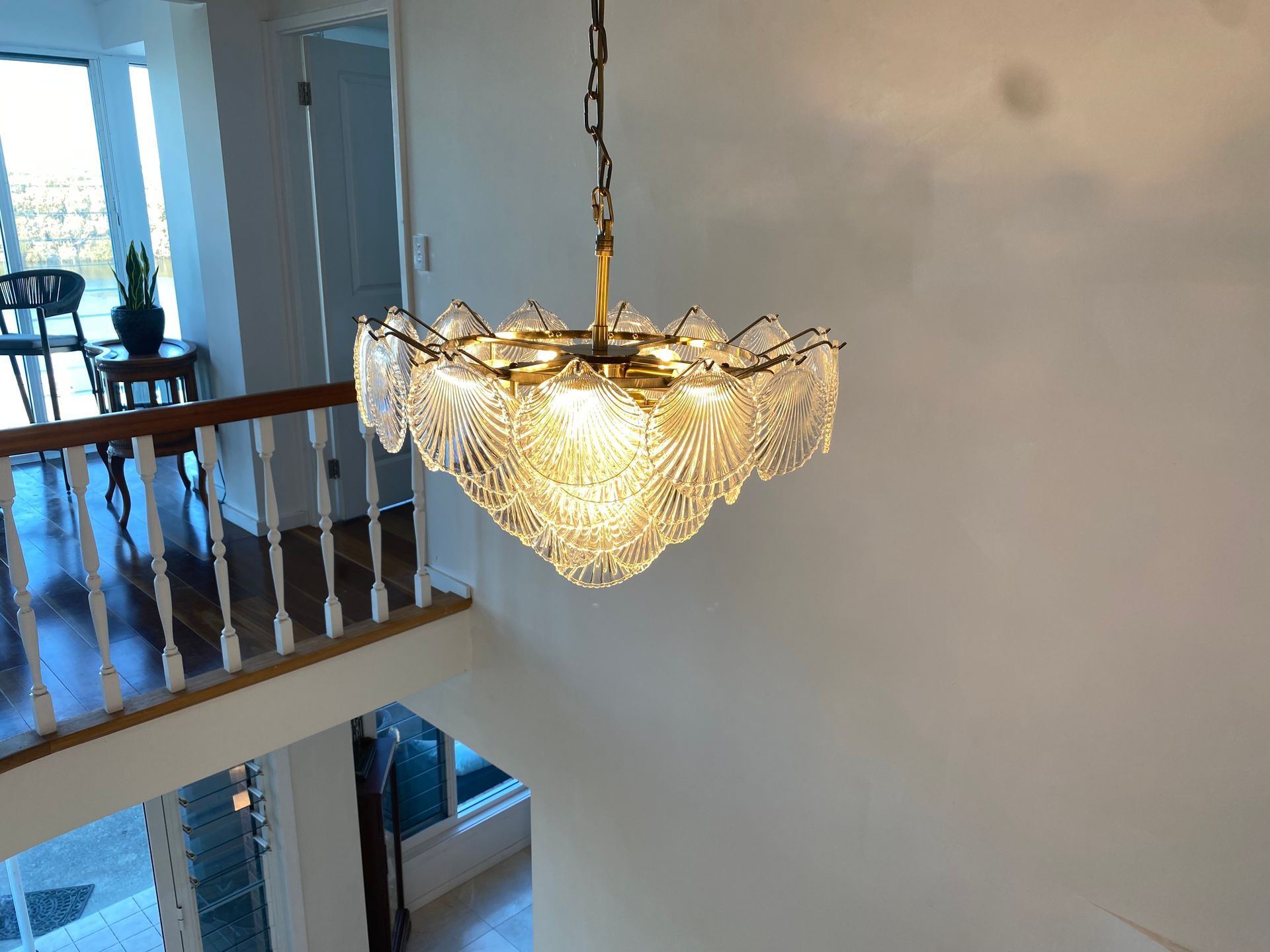 A tiered gold chandelier with textured glass panels — Channel Electrical In Swansea Heads, NSW