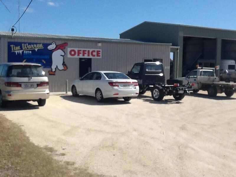 Cars Are Parked In Front Of The Tim Warren Office — Tim Warren Auto Airconditioning & Electrical In Bowen, QLD