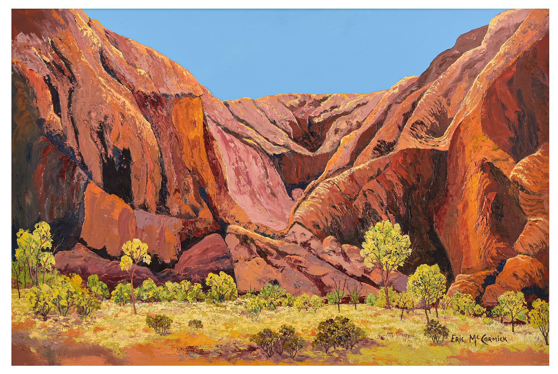 Red rock formation with blue sky, desert landscape with yellow grasses and small By The artist Eric McCormick trees.