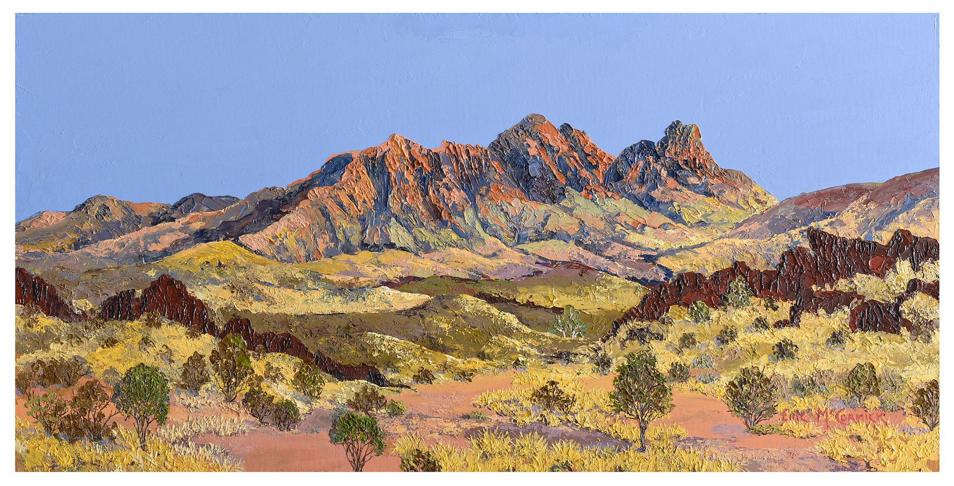 Mountain landscape painting with brown, gold, and red rocky peaks under a blue sky.By The artist Eric McCormick. 