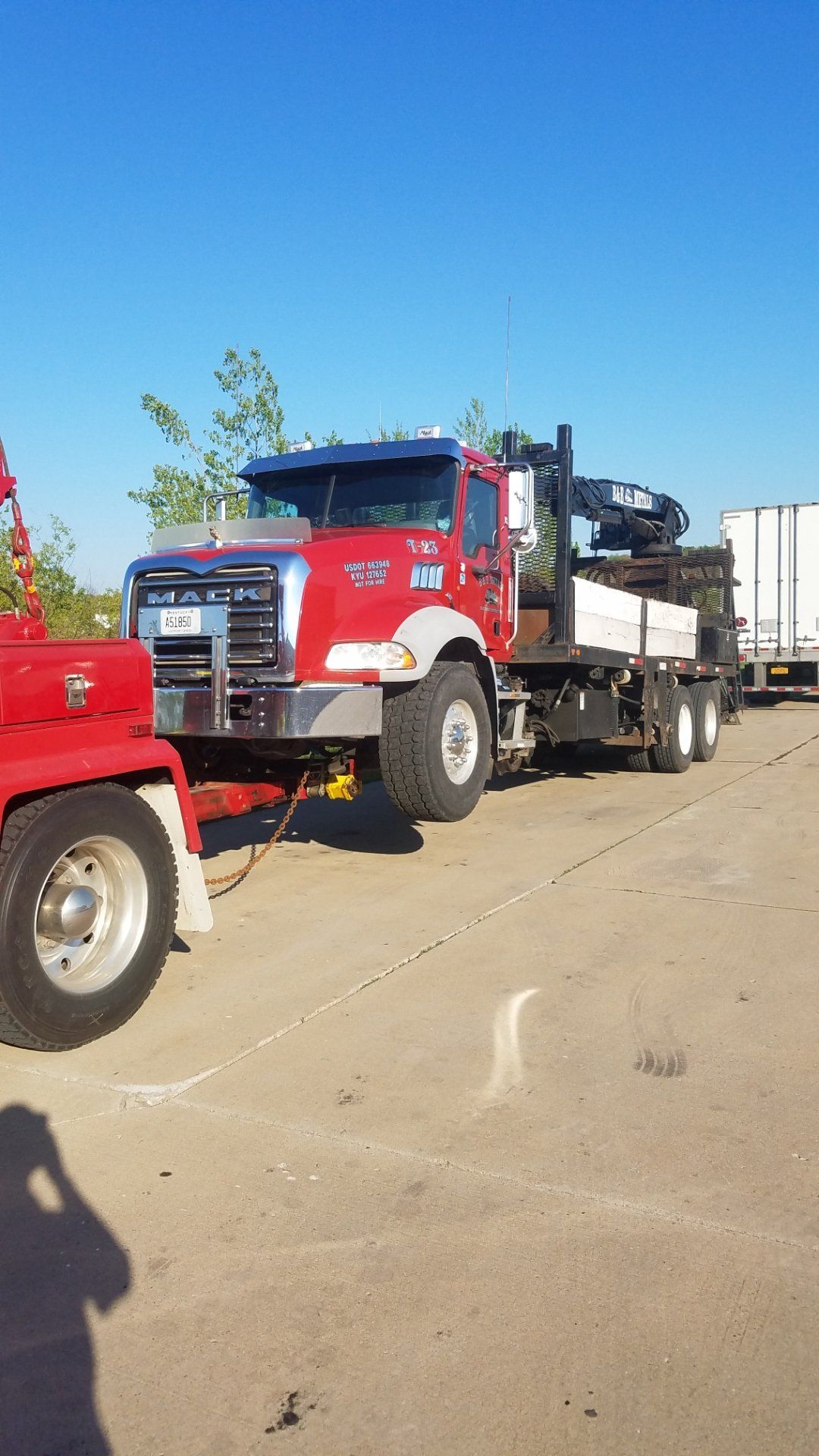 Red Mack truck on a sunny day