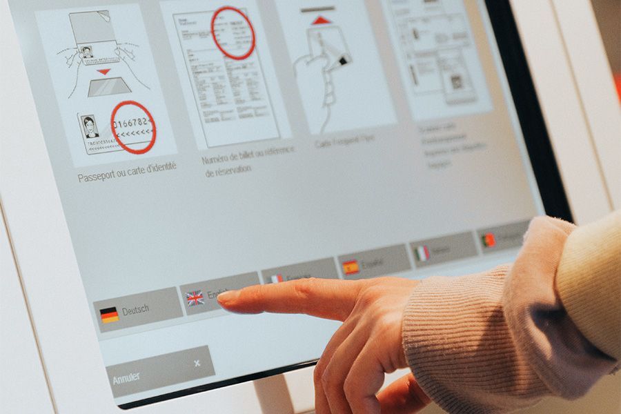 A person is pressing a button on a computer screen.