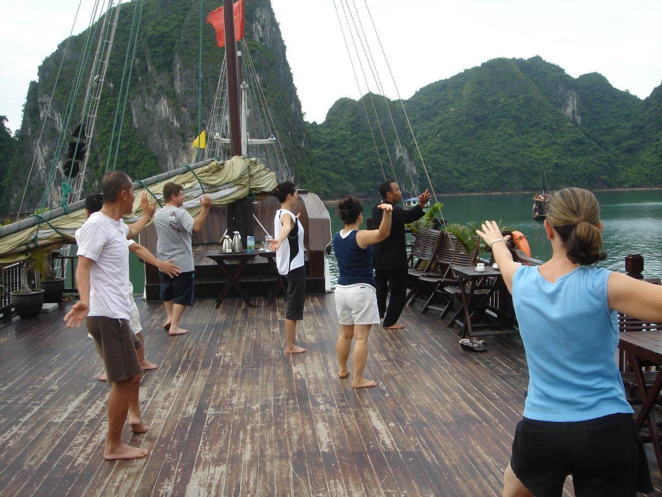 Lyn practicing yoga on a ship in Halong Bay, Vietnam