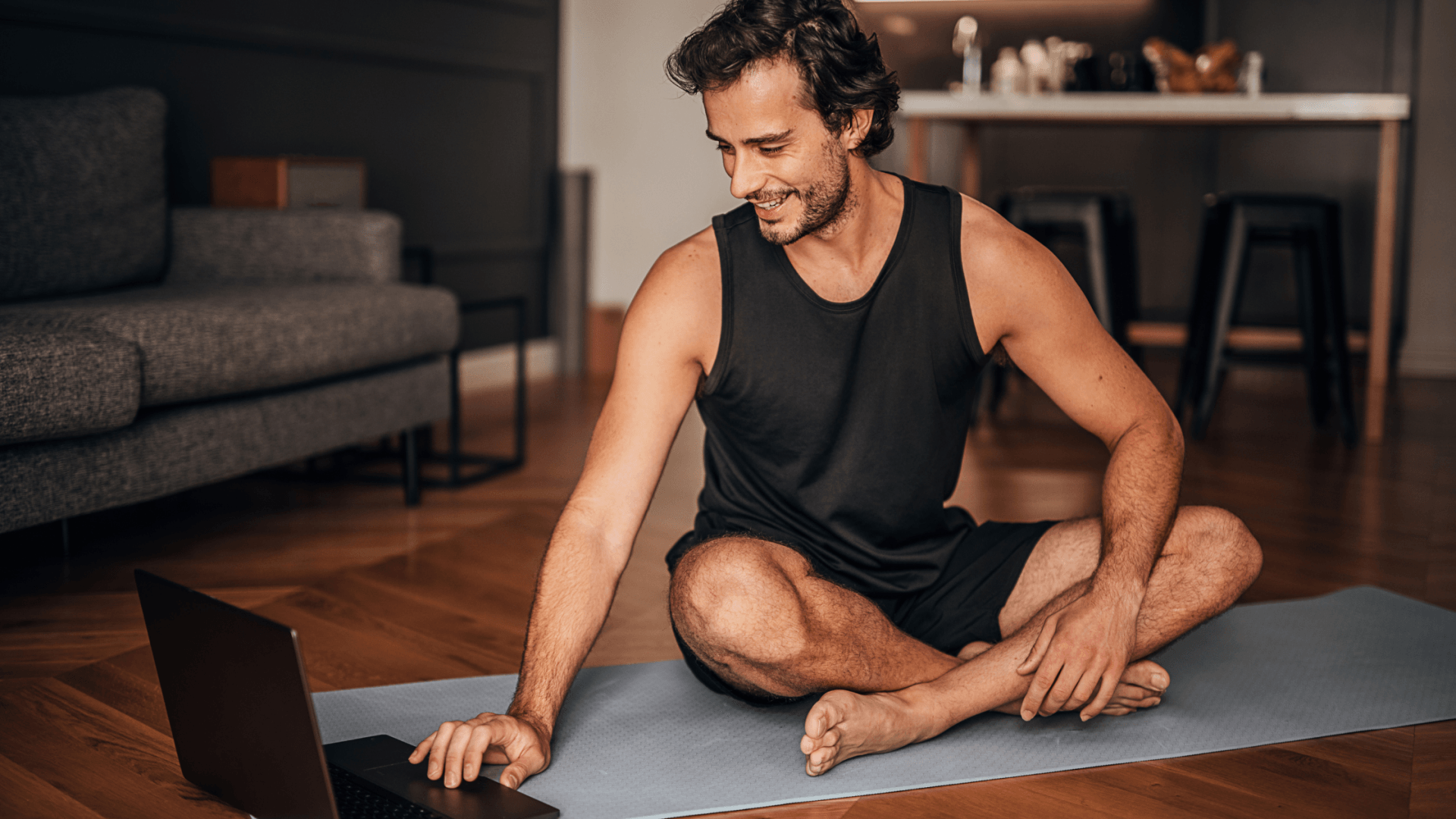 Male connecting to Livestream Yoga Class