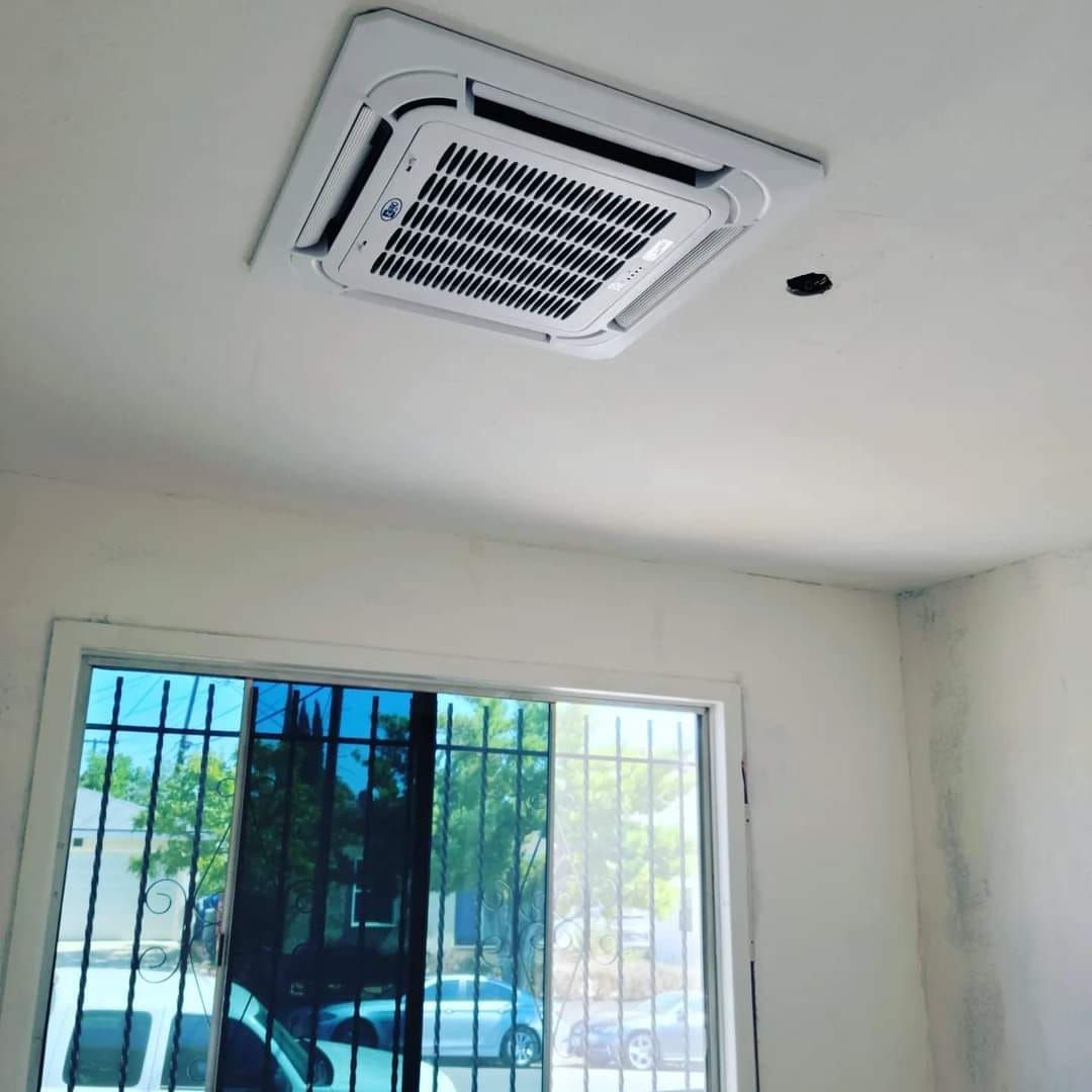 A room with a window and a ceiling fan