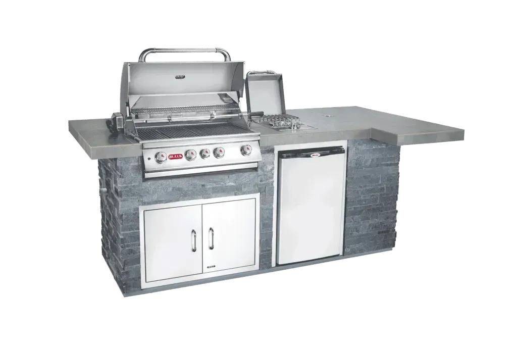 A stainless steel grill is sitting on top of a stone counter.