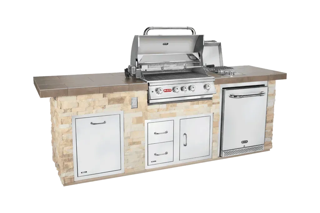 A stainless steel grill is sitting on top of a stone counter.