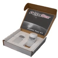 A cardboard box filled with a radon test kit.