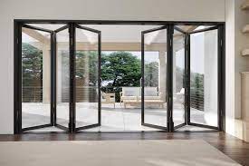 A living room with a large sliding glass door leading to a patio.