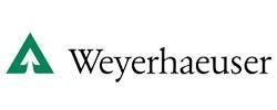 A weyerhaeuser logo with a green triangle on a white background.