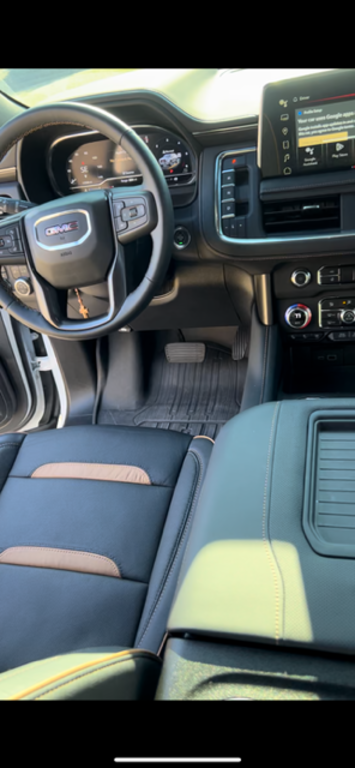 The interior of a gmc yukon is shown.