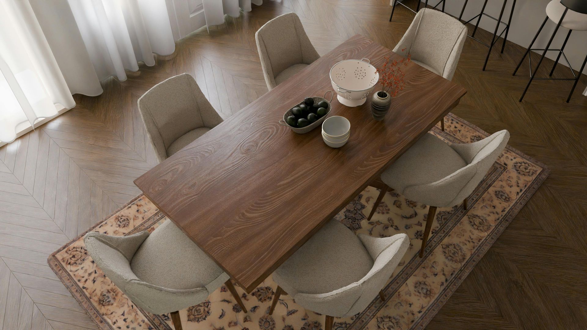 An aerial view of a dining room with a wooden table and chairs.