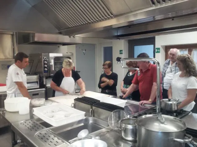 Cooking class in a professional kitchen.
