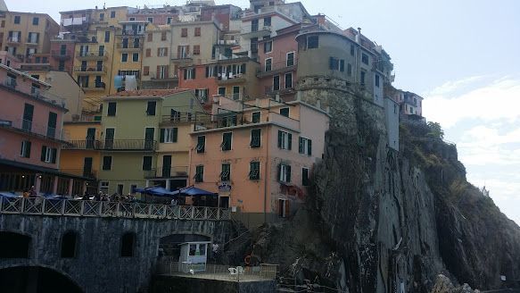 A group of buildings sitting on top of a hill.