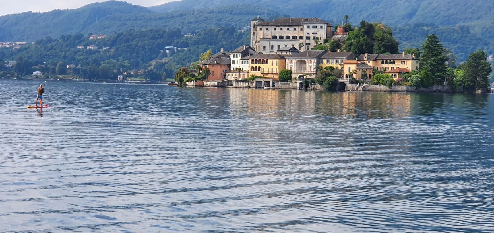 A large body of water with a small island in the middle