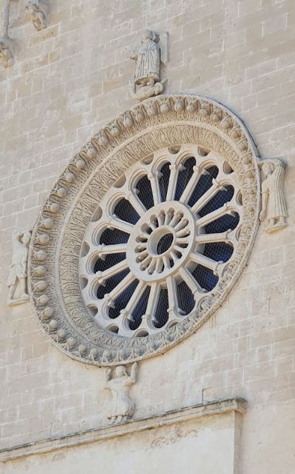 A circular window on the side of a building