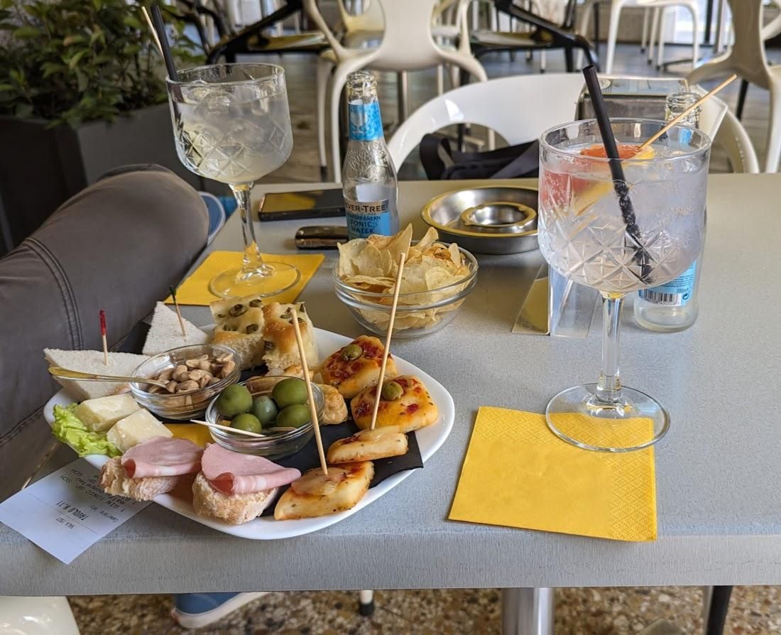 A table with a variety of food and drinks on it