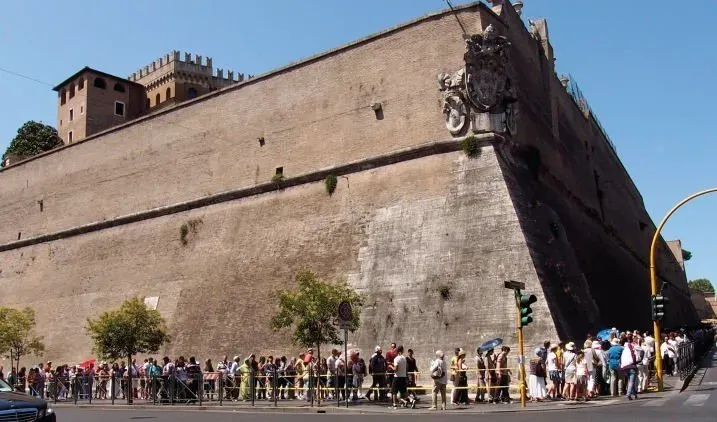 This is the exterior wall of Vatican City, with tourists lining up to enter the Vatican Museums.