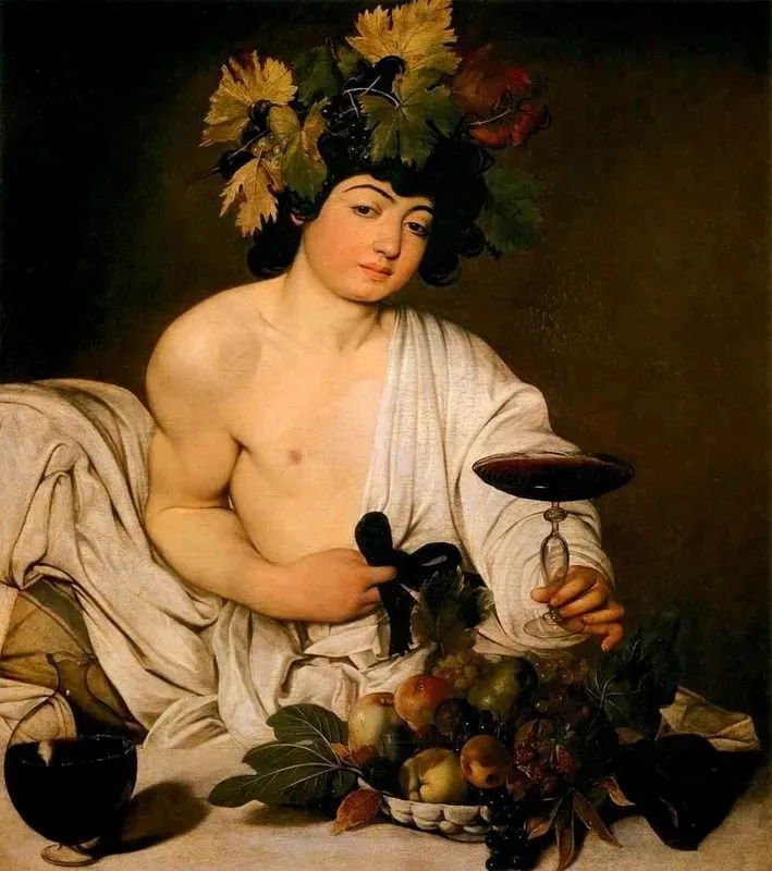 Young man dressed as Bacchus holding wine, surrounded by fruit.
