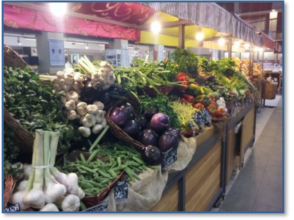 A bunch of vegetables are on display at a market