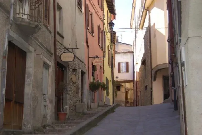 Wander uphill through timeless alleys where every stone has a story.