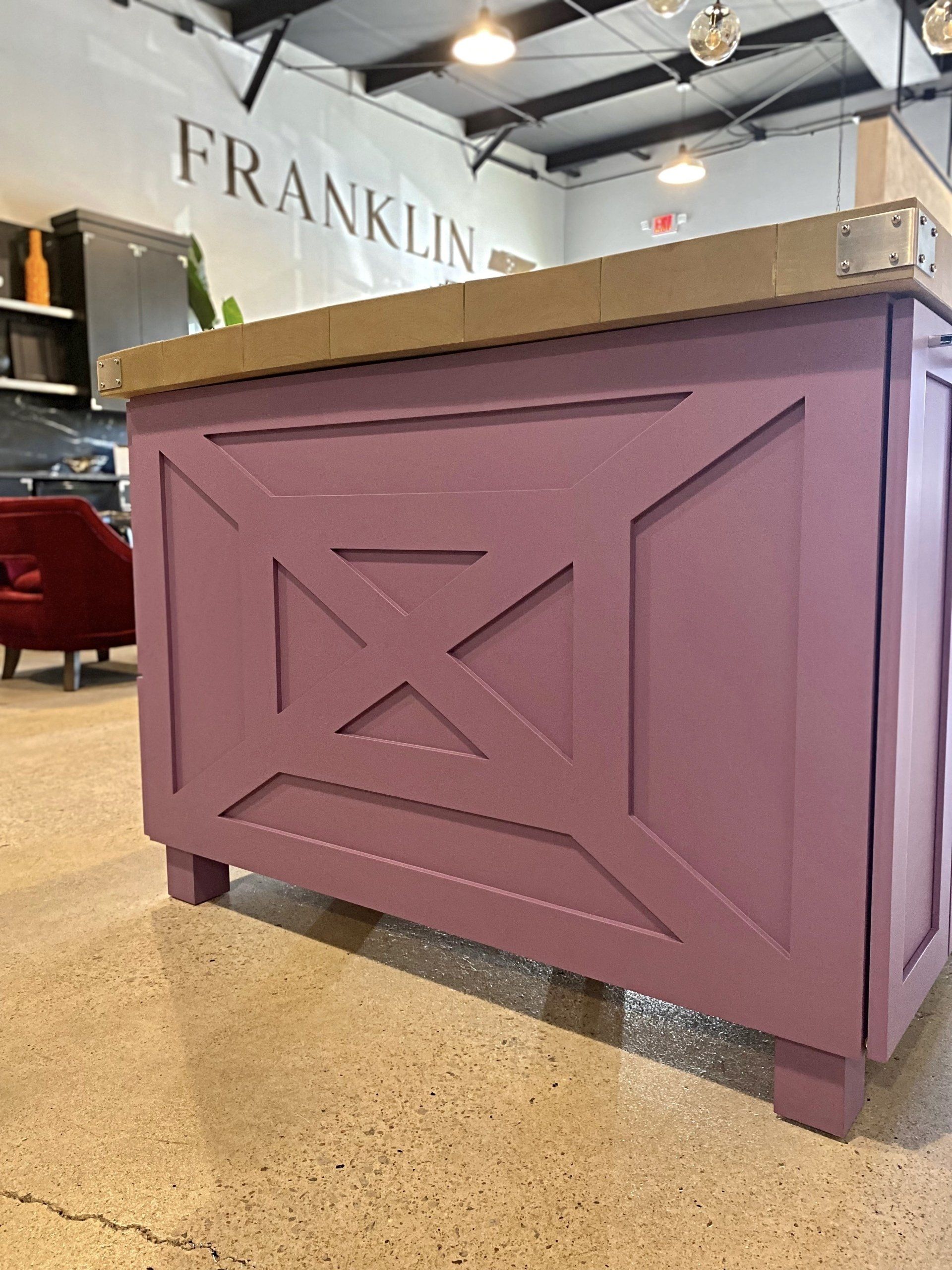 A purple counter in a room with the word franklin on the wall.