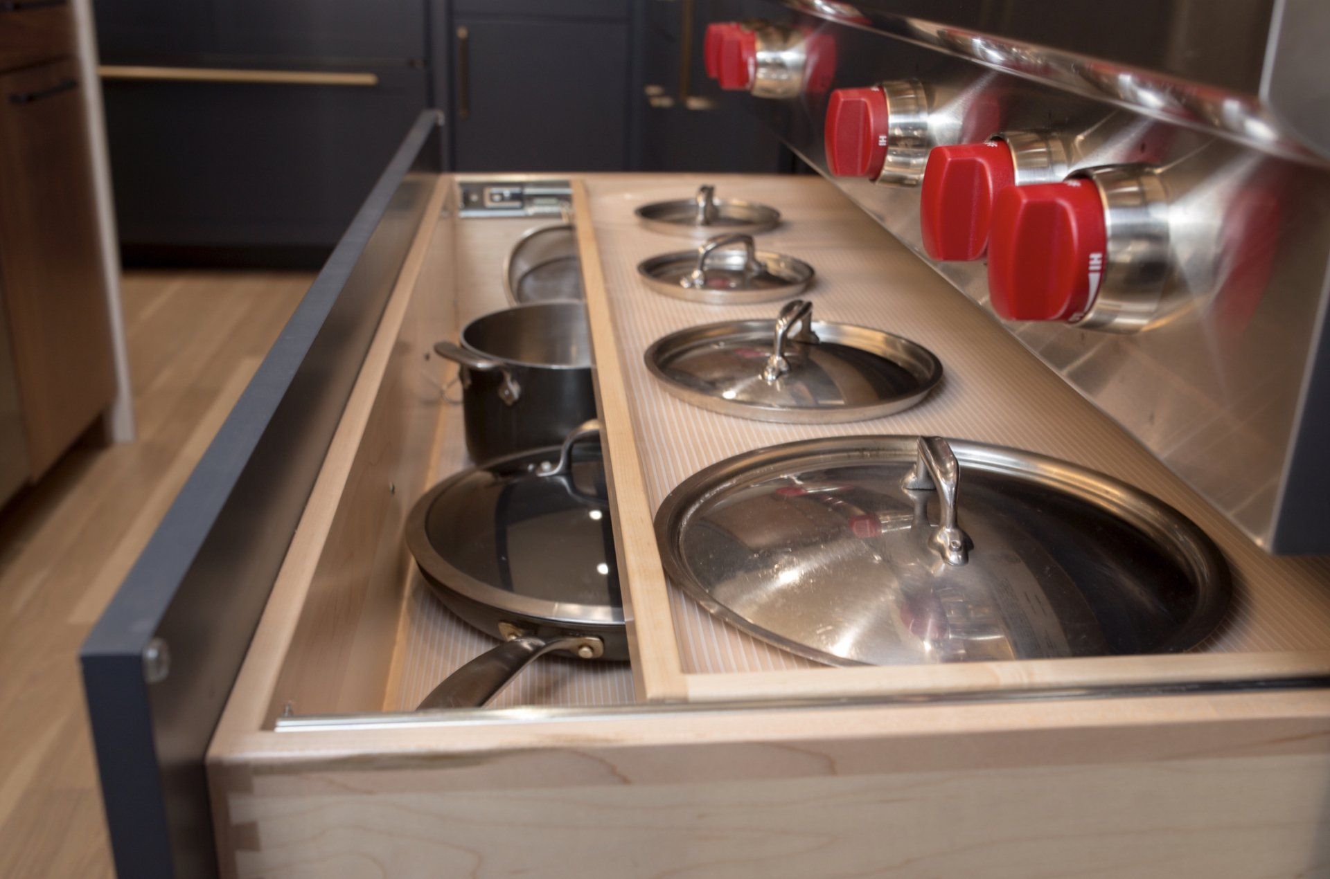 A kitchen counter with pots and pans in it