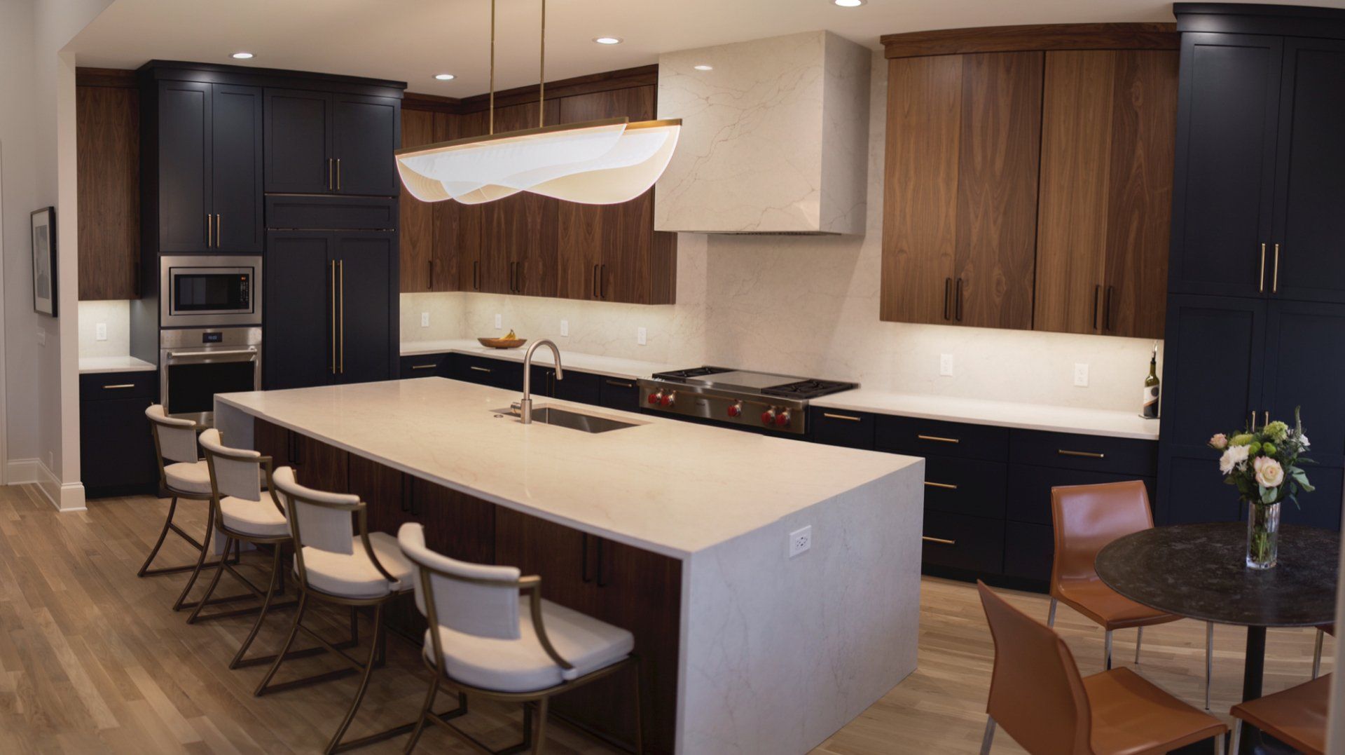 There is a large island in the middle of the kitchen.