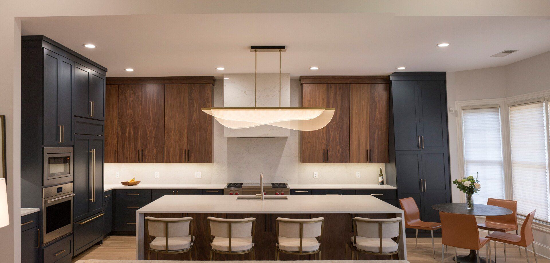 There is a large island in the middle of the kitchen.