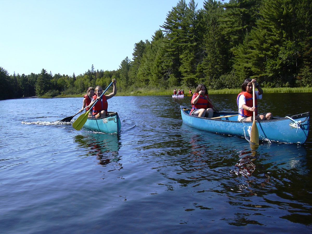 Students in canoes on a river