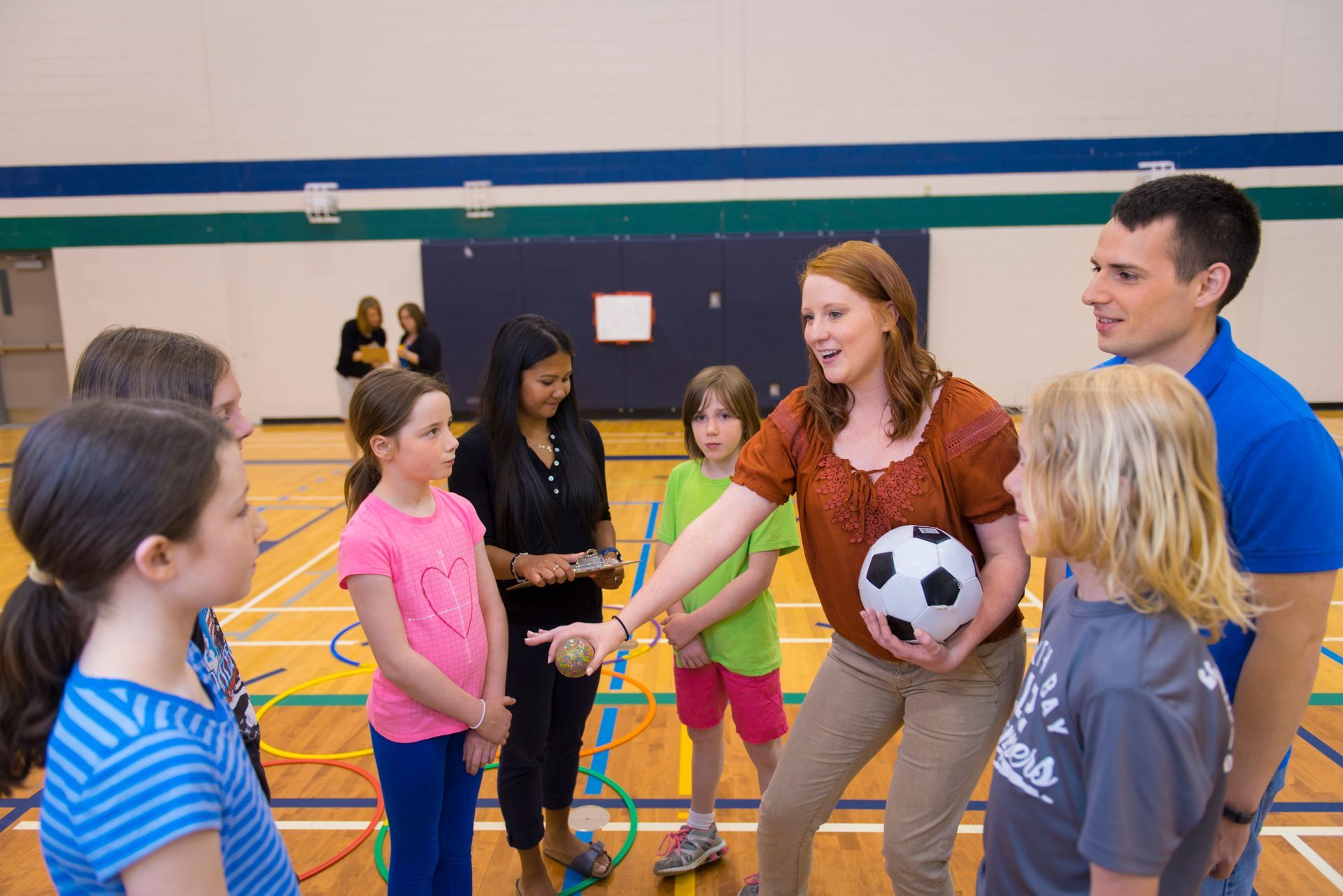 Students working with children
