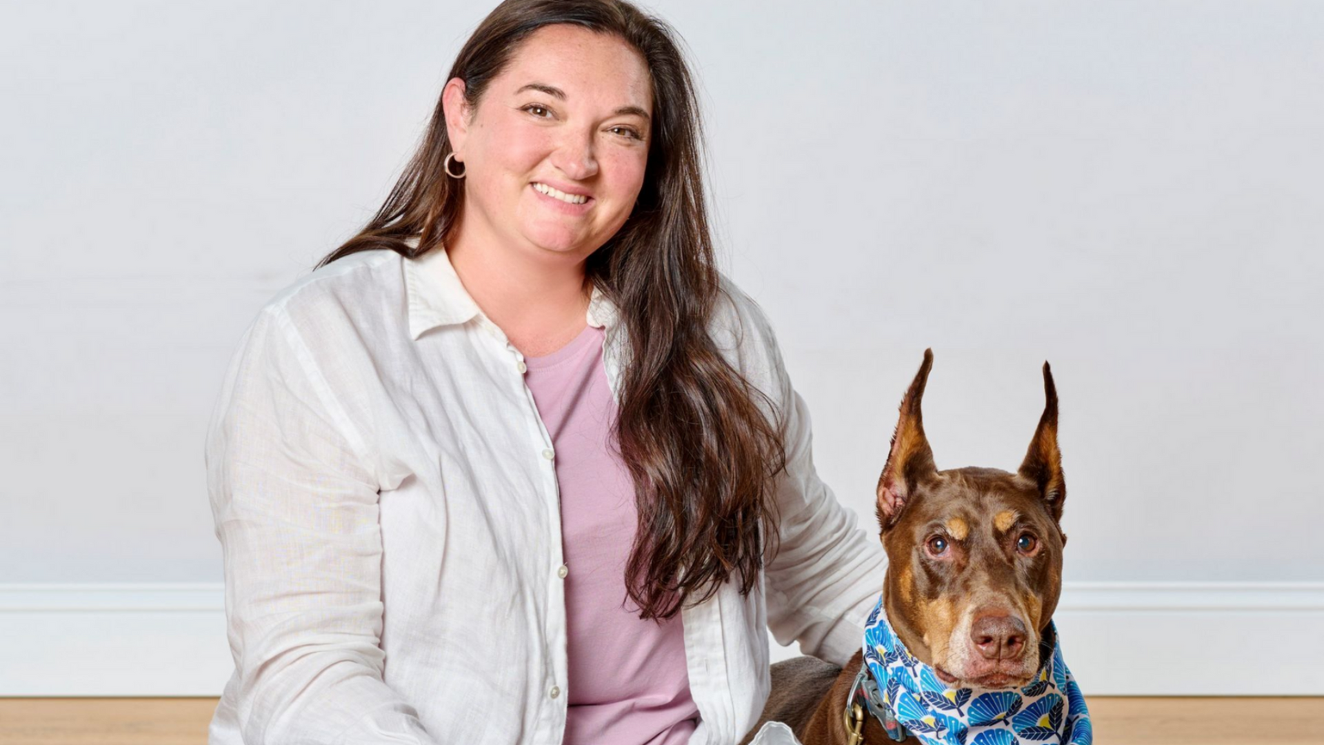 Dog wearing sunglasses and a bandana, with the text 