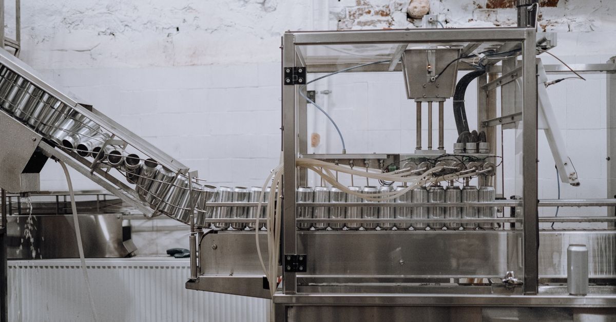Stainless steel food manufacturing production line in a processing facility.