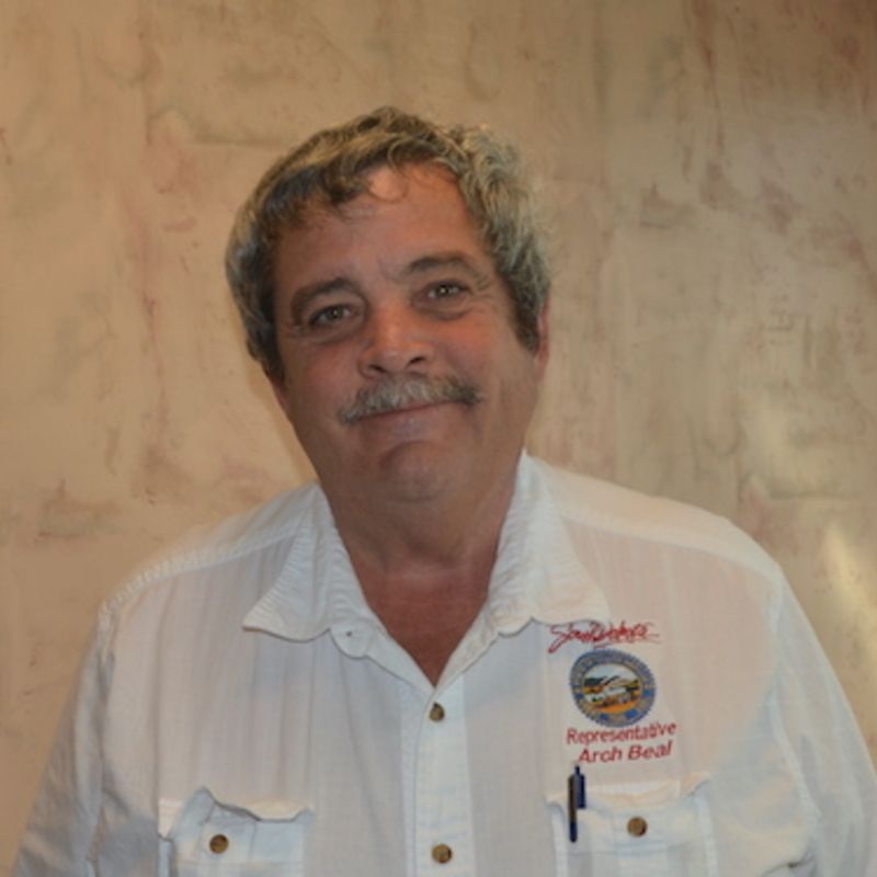 A man wearing a black shirt with the word digital on it