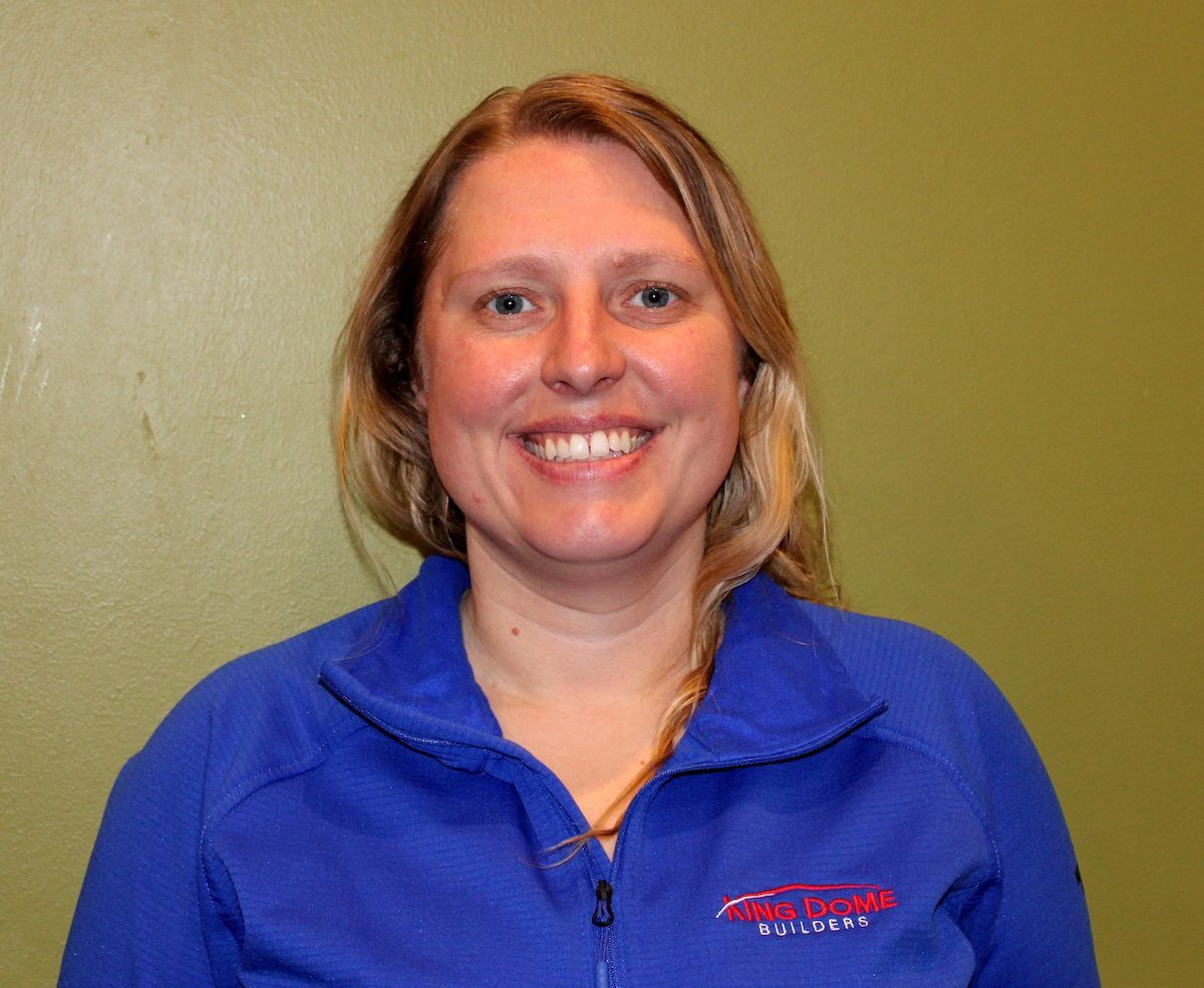A man wearing a black shirt with the word digital on it