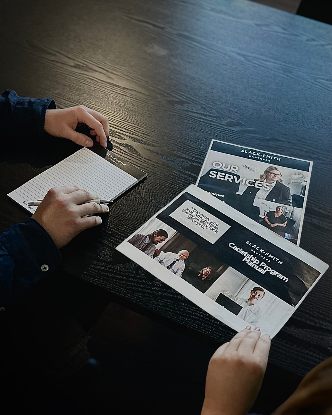 A Group of People Are Sitting Around a Table Looking at a Laptop — Slack-Smith Partners in Punjab, India