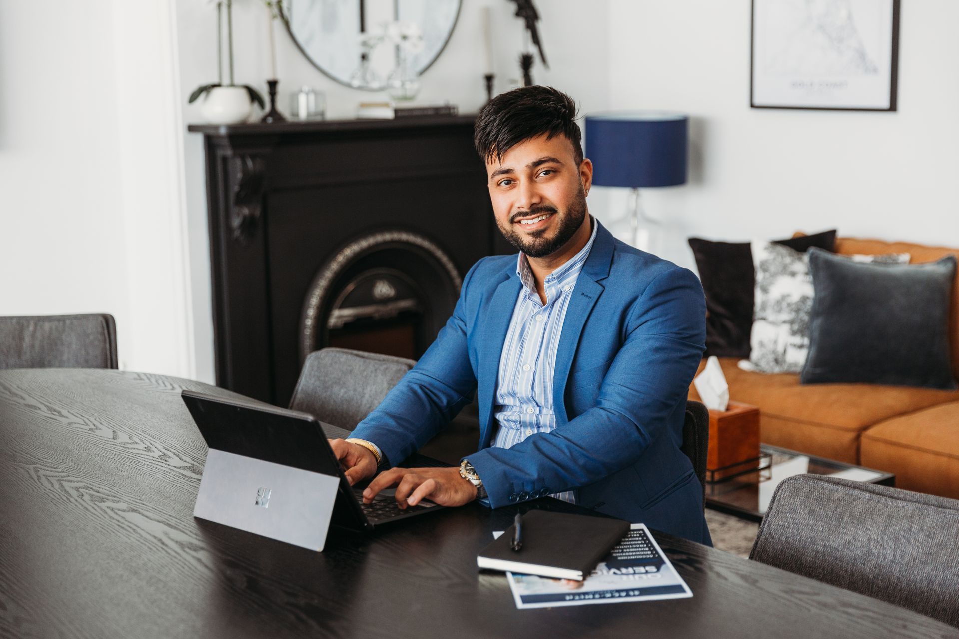 A Group of People Are Sitting Around a Table Looking at a Laptop — Slack-Smith Partners  in Punjab, India