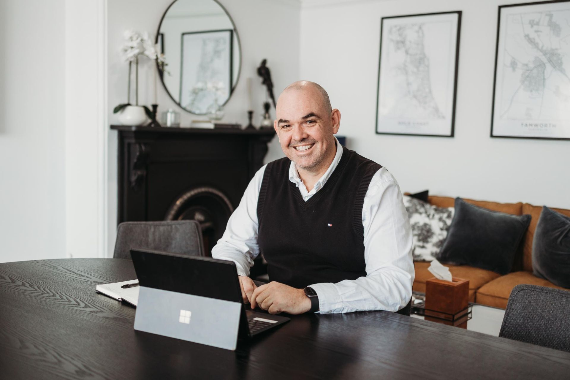 Man is Sitting at a Table With a Laptop on It — Slack-Smith Partners In Moree, NSW
