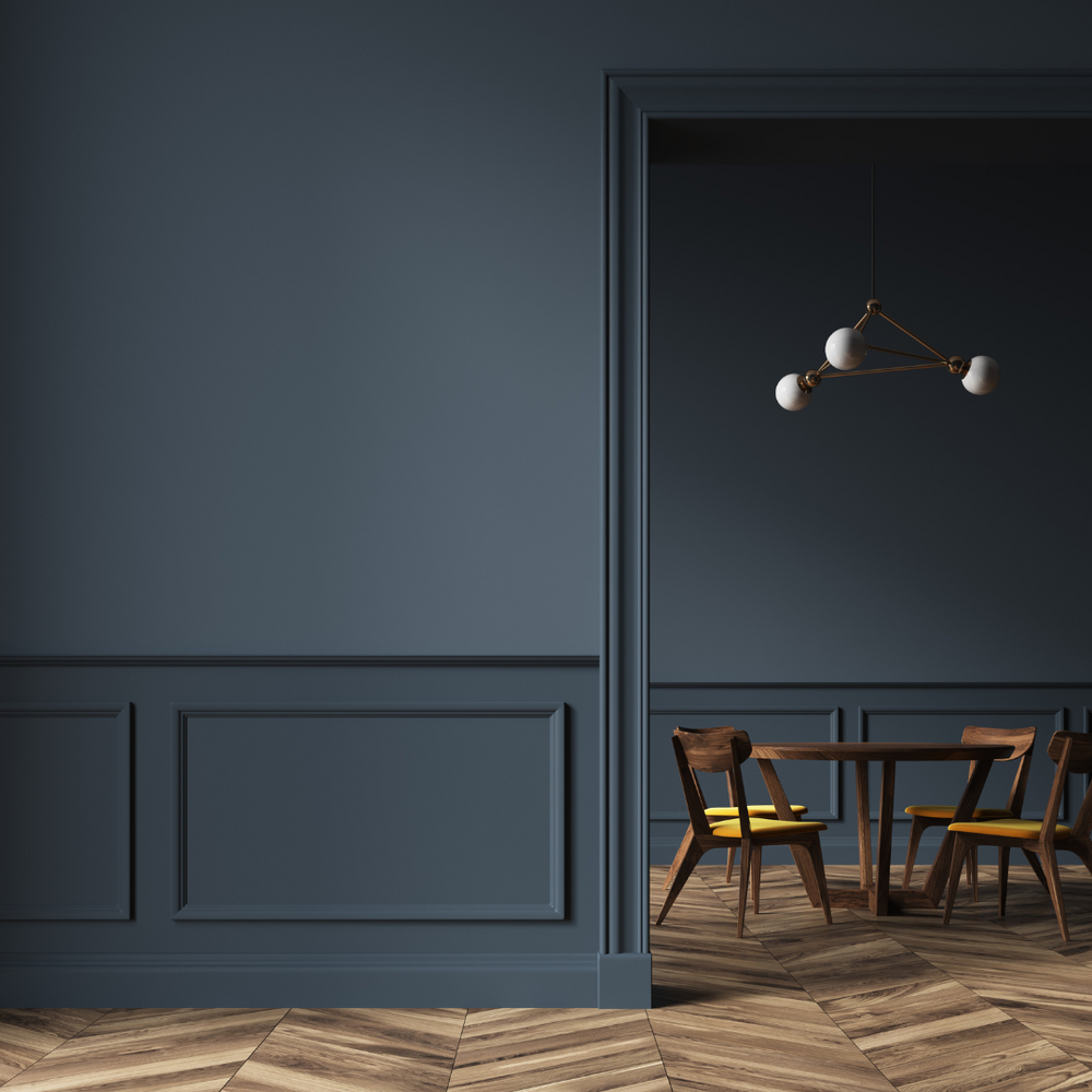 A Dining Room with A Table and Chairs and Dark Blue Walls — Slack-Smith Partners in Tamworth, NSW