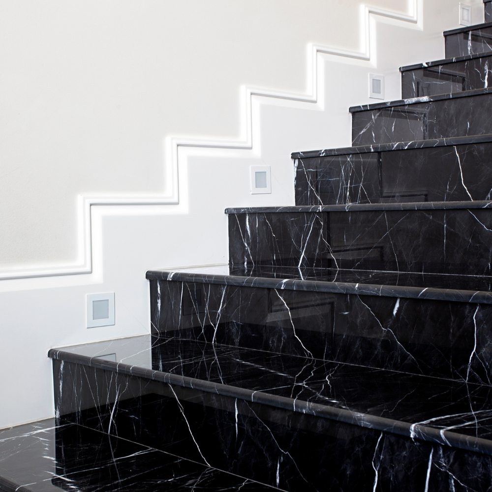 A Set of Black Marble Stairs Leading up To a White Wall — Slack-Smith Partners in Tamworth, NSW