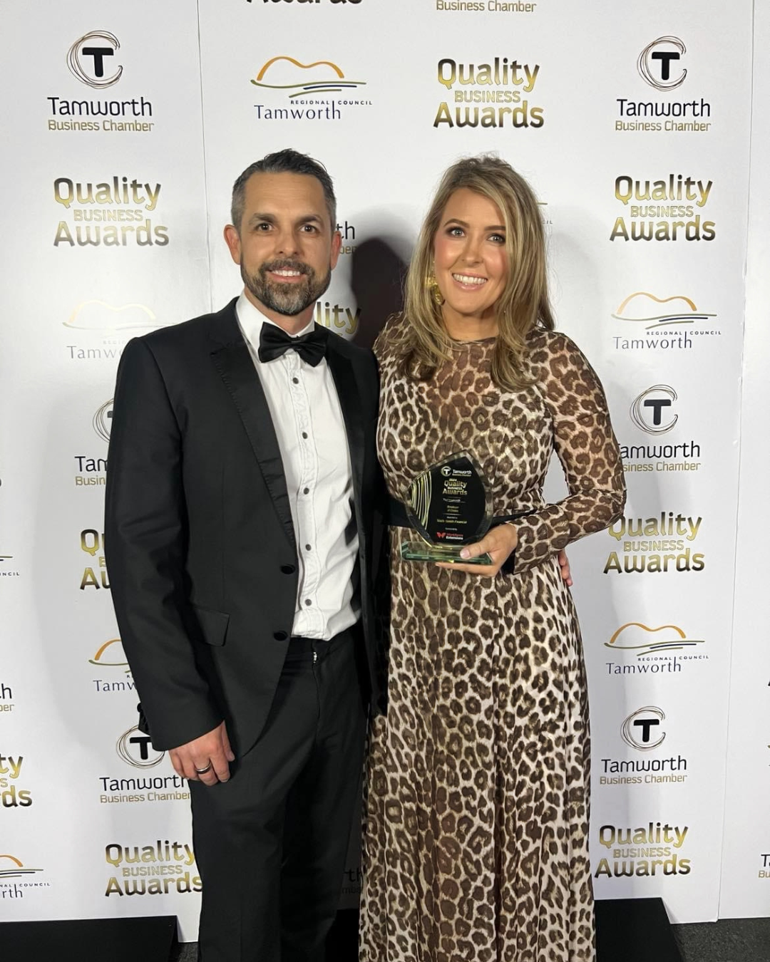 A Man and Woman Posing for a Photo With an Award at an Event — Slack-Smith Partners in Tamworth, NSW