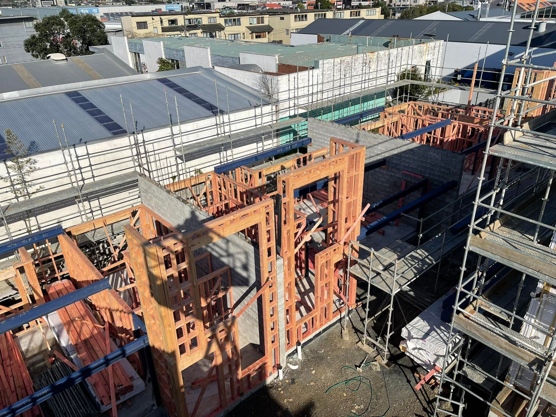Construction site with wooden framing and scaffolding. Construction site with wooden framing and scaffolding.